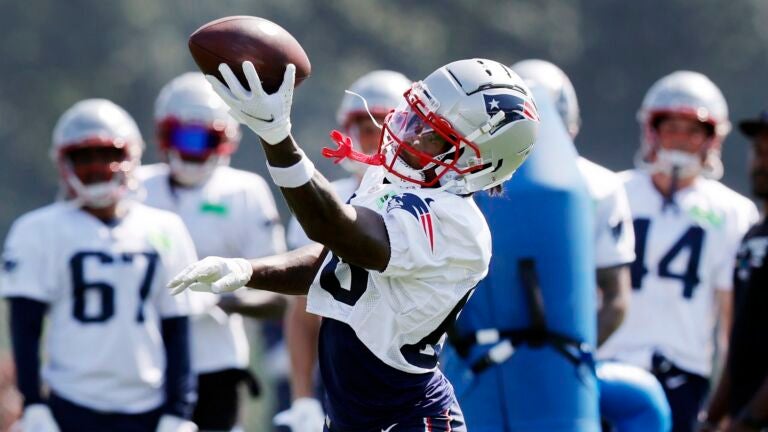 New England Patriots wide receiver Demario Douglas (60) makes a catch during an NFL football practice, Friday, July 28, 2023, in Foxborough, Mass.